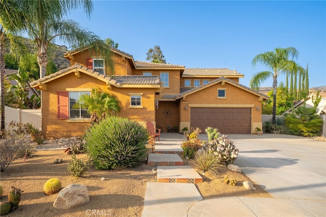30050 Cabo Del Oeste, Highland, CA 92346 - mediterranean / spanish-style home featuring stucco siding, driveway, an attached garage, and a tile roof