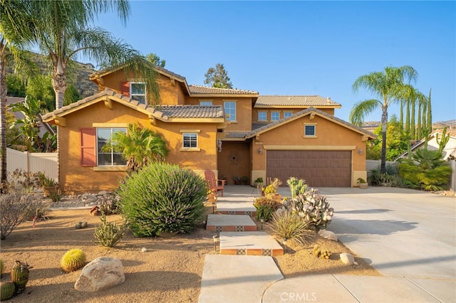 30050 Cabo Del Oeste, Highland, CA 92346 - mediterranean / spanish-style house with stucco siding, driveway, an attached garage, and a tile roof