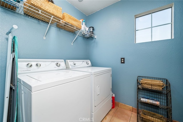 30050 Cabo Del Oeste, Highland, CA 92346 - laundry room featuring washer and clothes dryer and light tile patterned floors