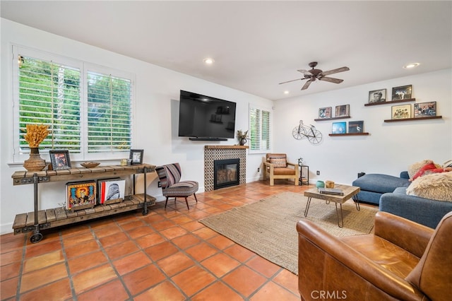 30050 Cabo Del Oeste, Highland, CA 92346 - living area with a tiled fireplace, tile patterned flooring, ceiling fan, and recessed lighting