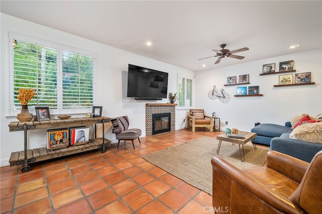 30050 Cabo Del Oeste, Highland, CA 92346 - living room with a tiled fireplace, tile patterned floors, ceiling fan, and recessed lighting