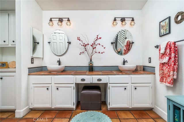 30050 Cabo Del Oeste, Highland, CA 92346 - bathroom featuring double vanity and tile patterned flooring