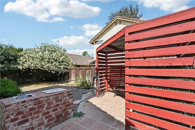 1497 Ruby Dr, Perris, CA 92571 - fenced backyard with a sink and a patio area