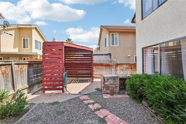 1497 Ruby Dr, Perris, CA 92571 - fenced backyard featuring a patio area
