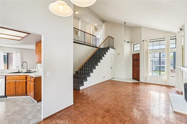 1497 Ruby Dr, Perris, CA 92571 - foyer featuring a textured ceiling, stairway, and high vaulted ceiling
