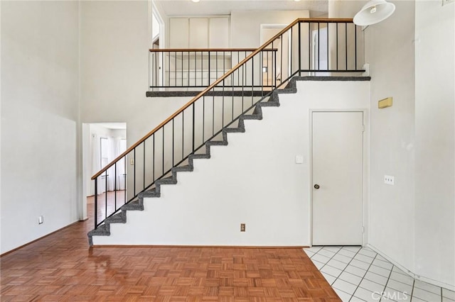 1497 Ruby Dr, Perris, CA 92571 - stairs with a towering ceiling and baseboards