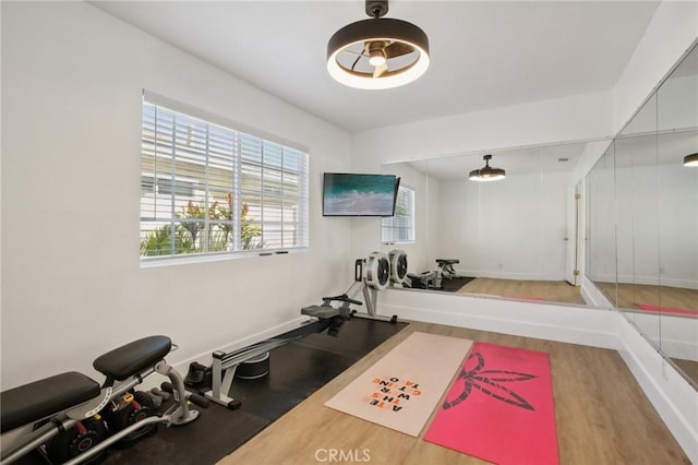 22832 Larkin St, Lake Forest, CA 92630 - exercise room featuring wood finished floors and baseboards