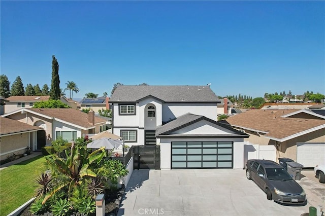 22832 Larkin St, Lake Forest, CA 92630 - view of front of home featuring stucco siding, a garage, driveway, and a residential view