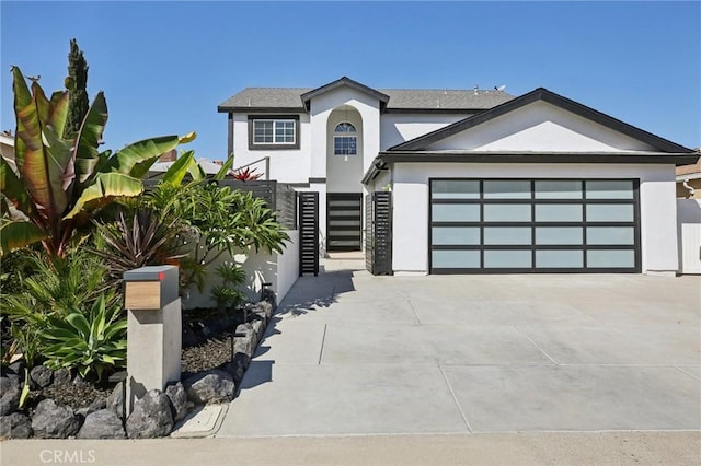 22832 Larkin St, Lake Forest, CA 92630 - view of front of home with stucco siding, driveway, and an attached garage