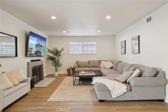 22832 Larkin St, Lake Forest, CA 92630 - living area featuring recessed lighting, a fireplace with flush hearth, and light wood-style floors