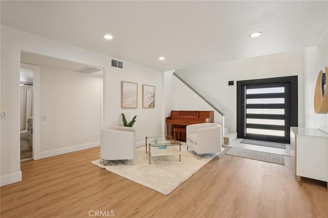 22832 Larkin St, Lake Forest, CA 92630 - sitting room with wood finished floors, stairs, and recessed lighting