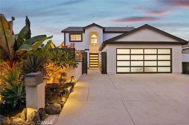 22832 Larkin St, Lake Forest, CA 92630 - view of front of house with stucco siding, concrete driveway, and a garage