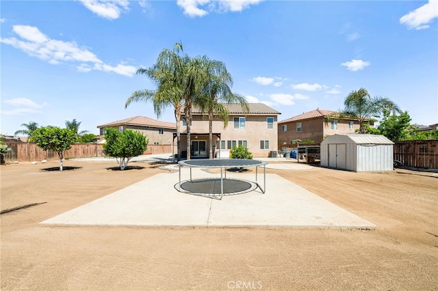25969 Magnifica Ct, Moreno Valley, CA 92551 - back of house with a shed, a fenced backyard, a patio, and stucco siding
