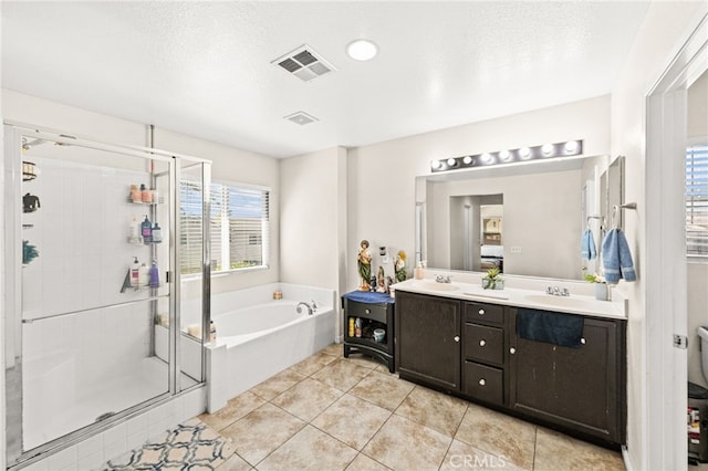 25969 Magnifica Ct, Moreno Valley, CA 92551 - full bathroom featuring a garden tub, double vanity, a stall shower, and tile patterned flooring