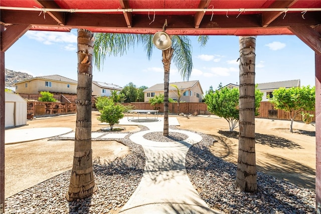 25969 Magnifica Ct, Moreno Valley, CA 92551 - view of patio featuring a storage unit and a residential view
