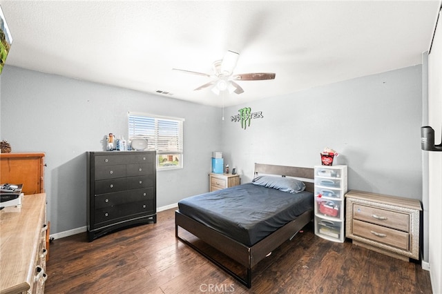 25969 Magnifica Ct, Moreno Valley, CA 92551 - bedroom with dark wood-style floors and a ceiling fan