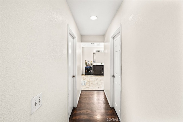 25969 Magnifica Ct, Moreno Valley, CA 92551 - hallway featuring wood finished floors, recessed lighting, and a textured wall