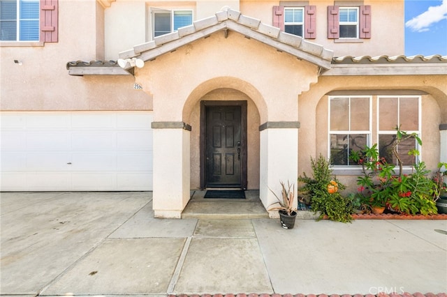 25969 Magnifica Ct, Moreno Valley, CA 92551 - view of exterior entry featuring stucco siding and concrete driveway
