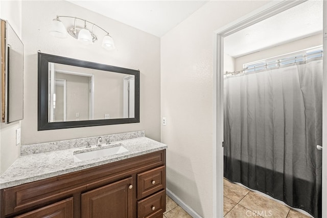 25969 Magnifica Ct, Moreno Valley, CA 92551 - bathroom featuring vanity, tile patterned floors, and a shower with curtain