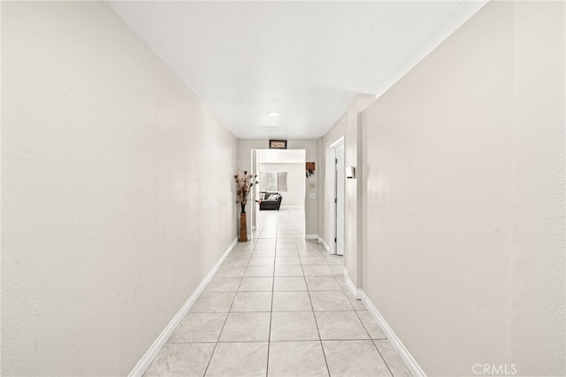 25969 Magnifica Ct, Moreno Valley, CA 92551 - corridor with light tile patterned floors and baseboards