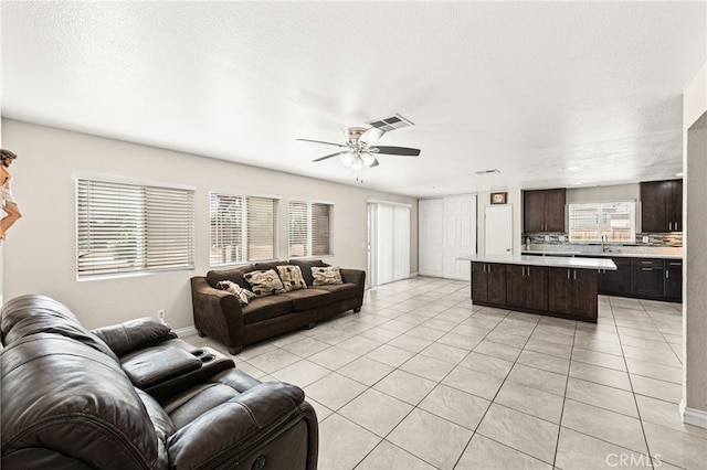 25969 Magnifica Ct, Moreno Valley, CA 92551 - living room featuring light tile patterned floors and a ceiling fan