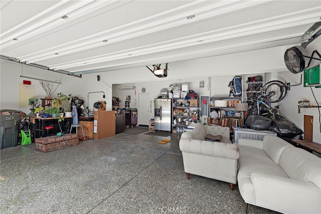 527 S Motif St, Anaheim, CA 92805 - garage with stainless steel refrigerator with ice dispenser and a garage door opener