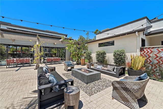527 S Motif St, Anaheim, CA 92805 - view of patio / terrace with an outdoor living space with a fire pit, outdoor dining space, and area for grilling