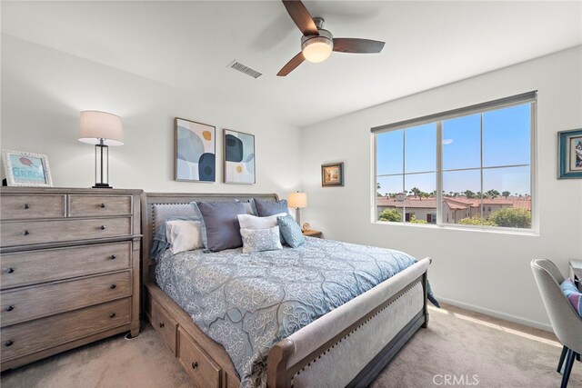 527 S Motif St, Anaheim, CA 92805 - bedroom with light colored carpet and a ceiling fan