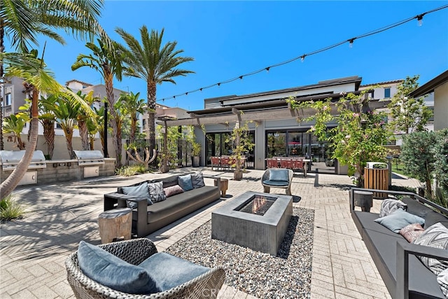 527 S Motif St, Anaheim, CA 92805 - view of patio / terrace featuring an outdoor living space with a fire pit, area for grilling, and a pergola