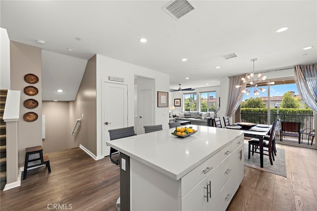 527 S Motif St, Anaheim, CA 92805 - kitchen featuring dark wood finished floors, a center island, recessed lighting, light countertops, and decorative light fixtures