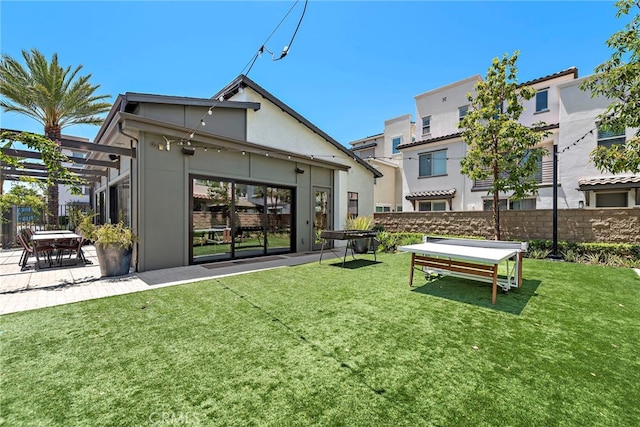 527 S Motif St, Anaheim, CA 92805 - back of house featuring a pergola, stucco siding, and a patio area