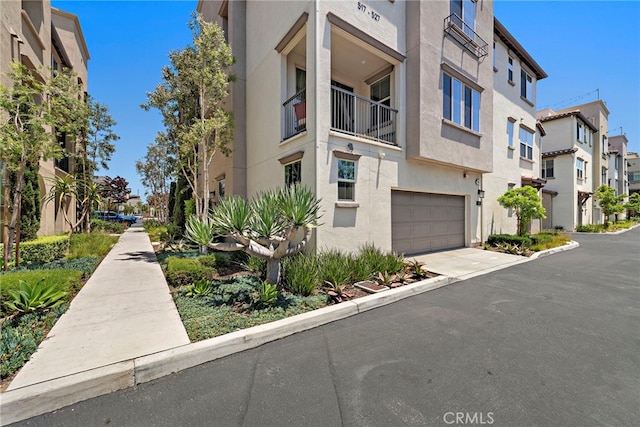 527 S Motif St, Anaheim, CA 92805 - view of property featuring a residential view, a garage, and concrete driveway