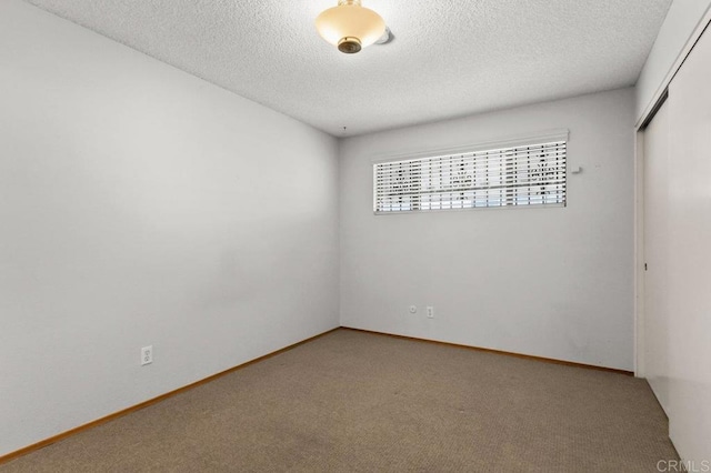 7384 Ballinger, San Diego, CA 92119 - spare room featuring carpet and a textured ceiling