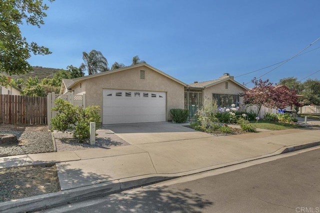 7384 Ballinger, San Diego, CA 92119 - ranch-style house with an attached garage, stucco siding, and driveway