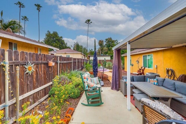  - fenced backyard featuring outdoor lounge area and a patio area