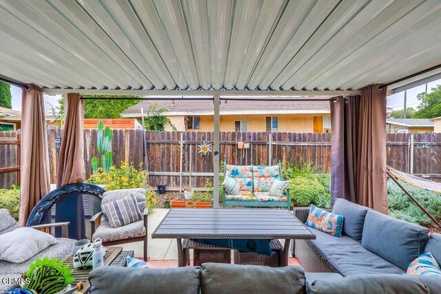 - fenced backyard featuring outdoor lounge area and a patio area