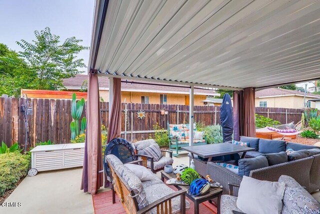  - fenced backyard featuring an outdoor hangout area and a patio