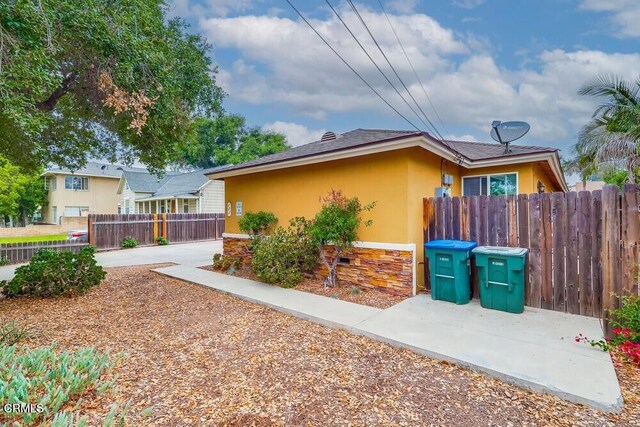  - view of property exterior with stucco siding