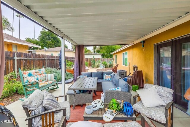  - fenced backyard featuring an outdoor hangout area