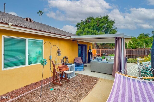  - view of patio with an outdoor hangout area