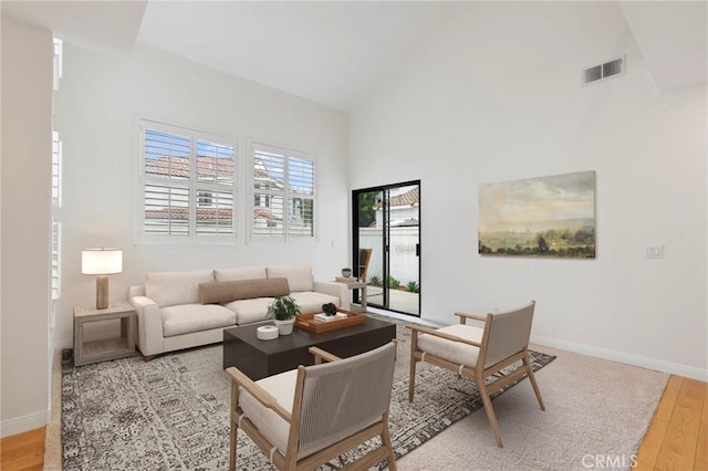 9765 Alburtis Ave Unit 131, Santa Fe Springs, CA 90670 - living room with wood finished floors and high vaulted ceiling