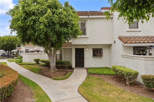 9765 Alburtis Ave Unit 131, Santa Fe Springs, CA 90670 - multi unit property featuring a tile roof and stucco siding