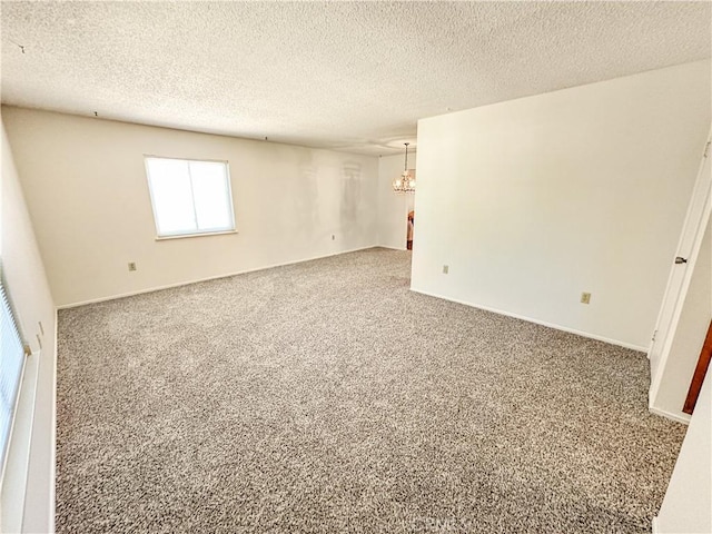 630 N 10 Th St, Blythe, CA 92225 - carpeted empty room featuring a chandelier and a textured ceiling
