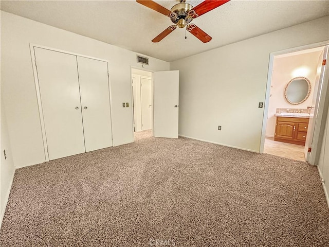 630 N 10 Th St, Blythe, CA 92225 - unfurnished bedroom with light carpet, a closet, ensuite bath, and ceiling fan