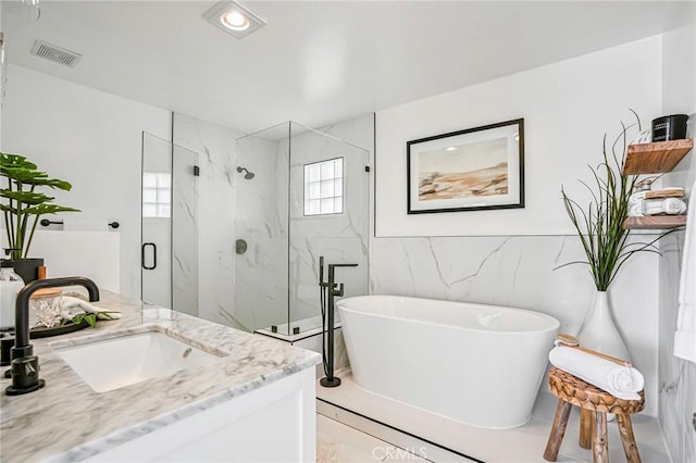 4216 Highland Ave Unit B, Manhattan Beach, CA 90266 - bathroom with a marble finish shower, a freestanding bath, tile walls, vanity, and marble finish flooring