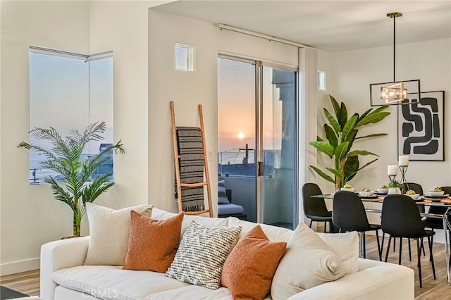 4216 Highland Ave Unit B, Manhattan Beach, CA 90266 - living area with light wood-style floors and a chandelier