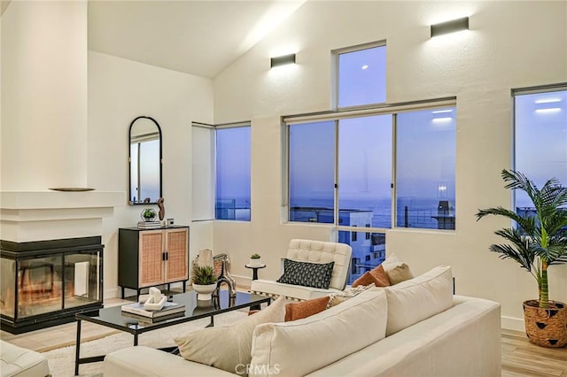 4216 Highland Ave Unit B, Manhattan Beach, CA 90266 - living area with wood finished floors, a water view, and vaulted ceiling