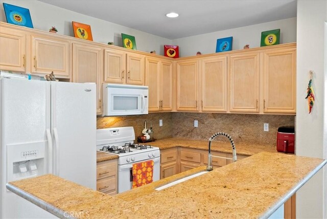 253 Kieswetter St, Colton, CA 92324 - kitchen featuring white appliances, light brown cabinetry, tasteful backsplash, and a peninsula