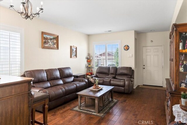 253 Kieswetter St, Colton, CA 92324 - living area with a chandelier and dark wood-type flooring
