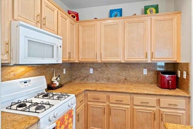 253 Kieswetter St, Colton, CA 92324 - kitchen with white appliances, light brown cabinets, and backsplash